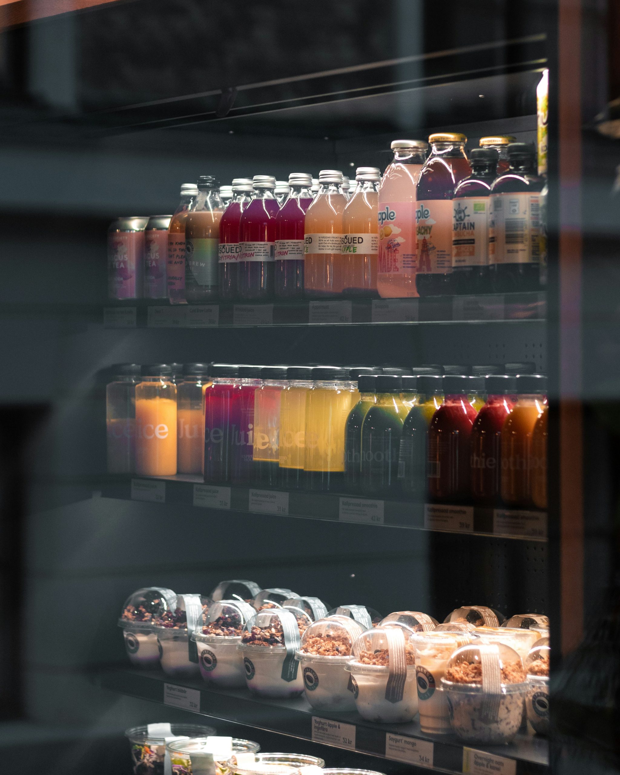 A close-up of fruit pots stored in a smart fridge.